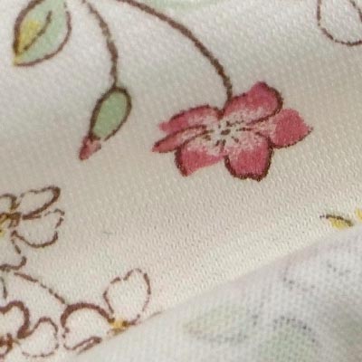 SZ天竺イラストプリント（フラワー）表面感><br clear=